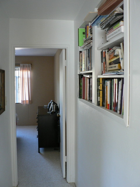 outside the bathroom look down the hallway toward the back of the house, to the master bedroom