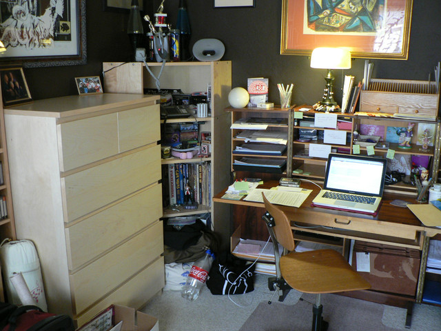 it looks cramped from this angle, but having all that dresser space is actually a boon - it's no longer in the living room!