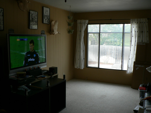 look!  we've removed the ugly dresser and open bookshelves full of stuff!