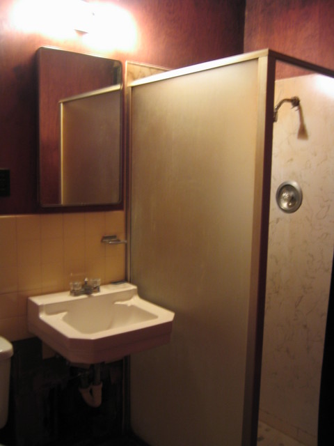 and door to tiny bathroom