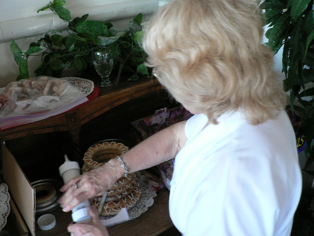 Lynn (Jim's mom) decorates the kransekaka