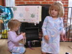 Ava and Ella play with beads