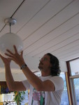 Uncle Jim replaces the lightbulb