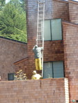 people pressure washing