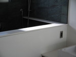 Shower wall cap and shower shelf