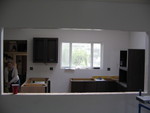 View from the living room. The paint has a slight pink to it but it's not so strong with the dark cabinets in.