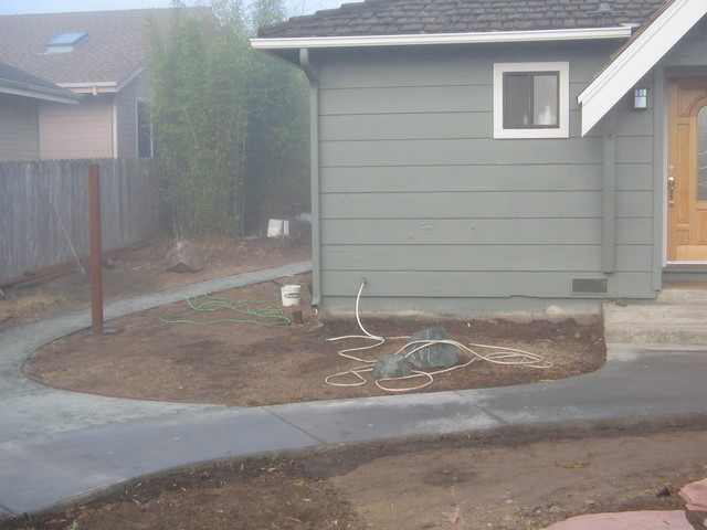 Boulder to the left of the front door