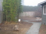The fence that blocked off the back yard is now gone, and a boulder