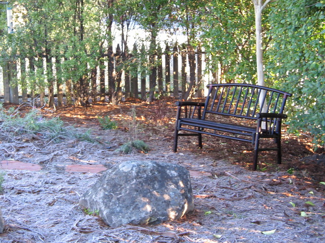 The bench near the rock in front and you can see it's pretty cold