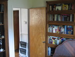 The book cases by the door.