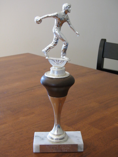 1983-1984 Saturday Juniors for high team game handicap (834). Nicole had me keep this trophy because she thinks it looks good.